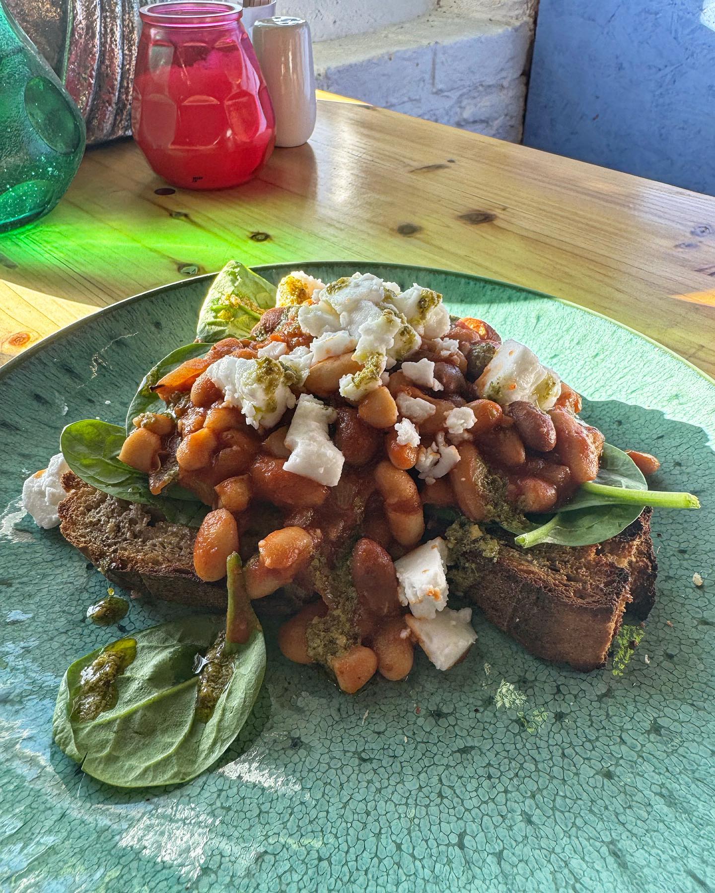 Baked beans and feta on toast with spinach