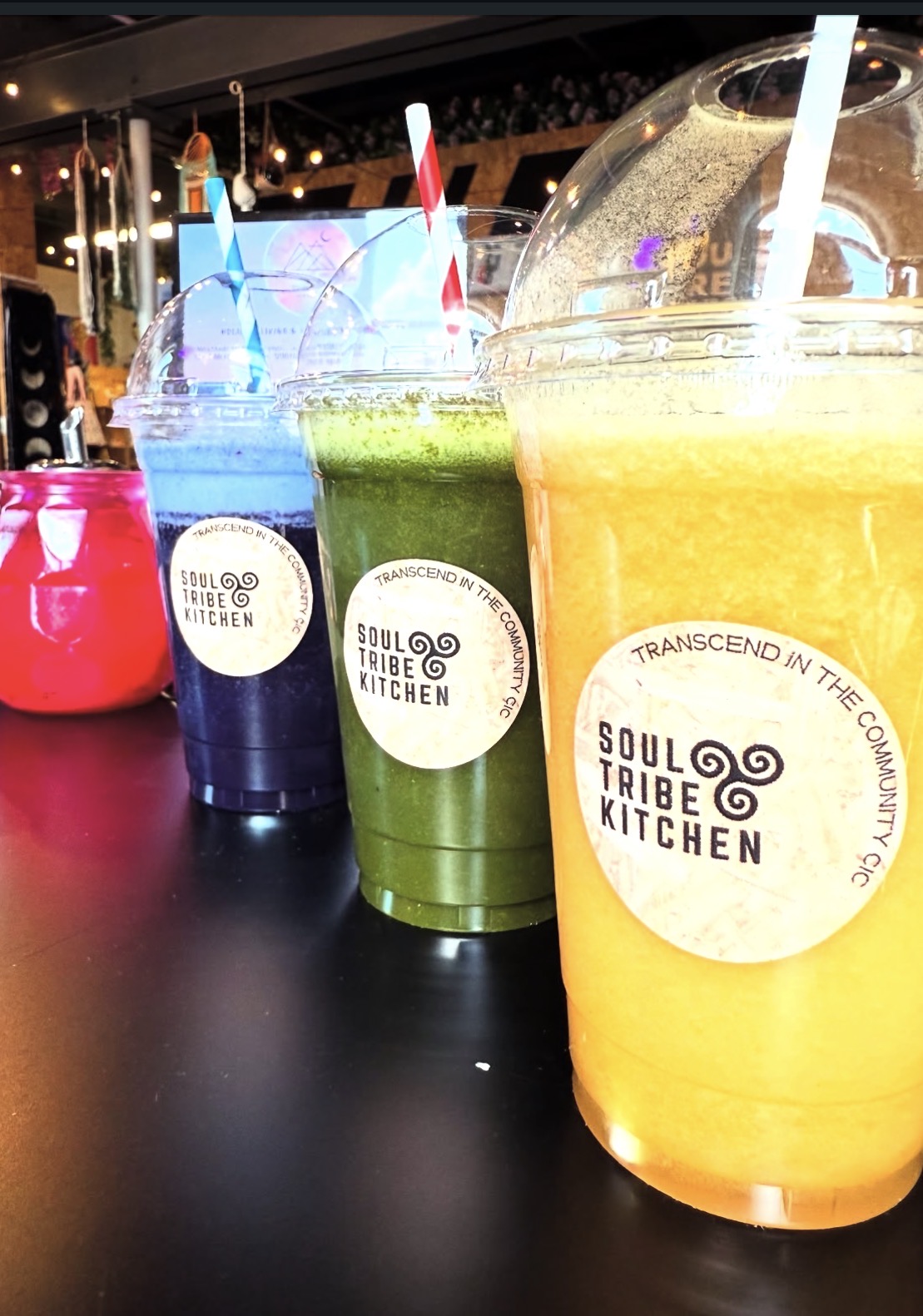 Blue, green and orange Soul Tribe Kitchen smoothies