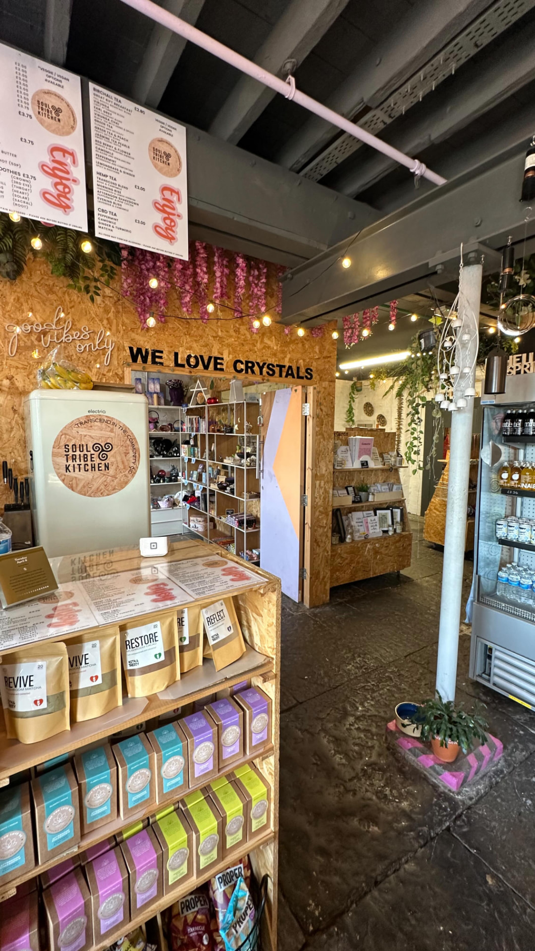 Inside Soul Tribe Kitchen — counter, shelves and shop area